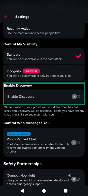 The Tinder settings menu showing the Enable Discovery option toggled off.
