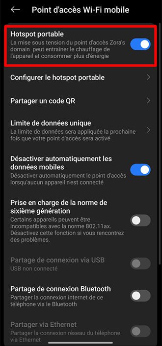 Android Connection and sharing screen showing Portable hotspot option toggled on in hotspot settings.